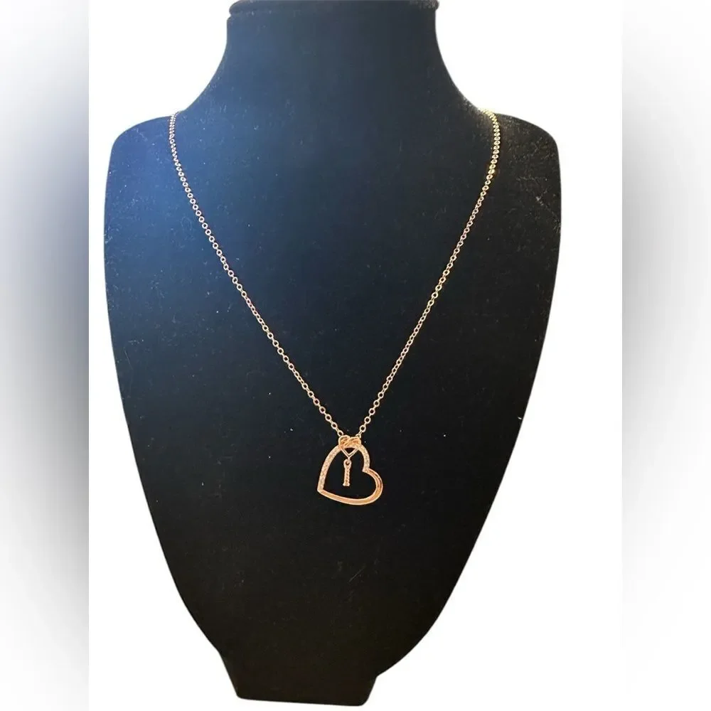 Anoup Rose Gold “I” initial necklace.